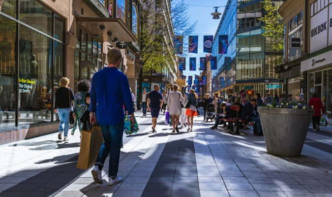 People shop in Stockholm, Sweden. (Tomas Williams/Unsplash) middle class retail