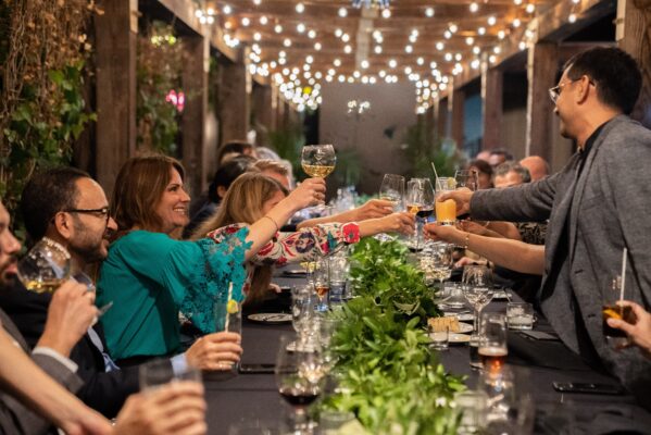 Lindsay Hampson (EMBA '22) celebrating a toast with her peers in the Executive MBA program at the DeGroote School of Business.